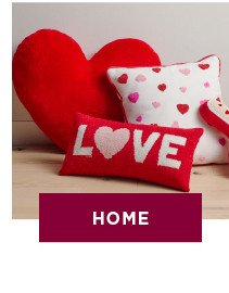 three valentines day pillows stacked against each other